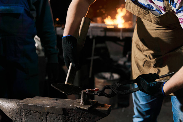 blacksmith forges a horseshoe, close-up - Photo, Image