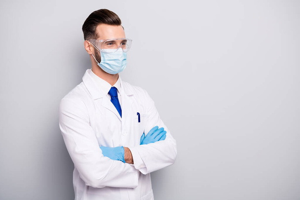 Profile side portrait of his he nice attractive cheerful experienced doc scientist dentist surgeon apothecary physicist folded arms isolated on light white gray pastel color background - Photo, image