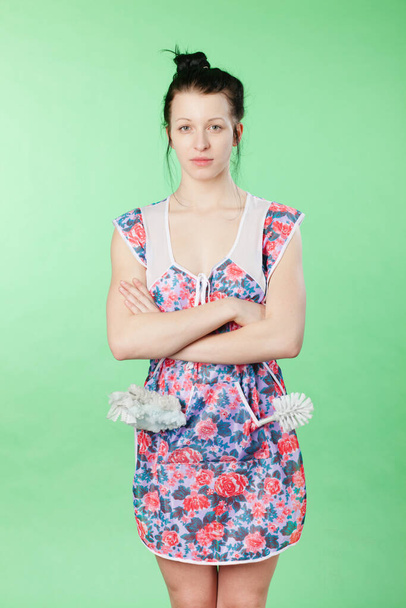 young woman in a green dress on a blue background - Foto, immagini