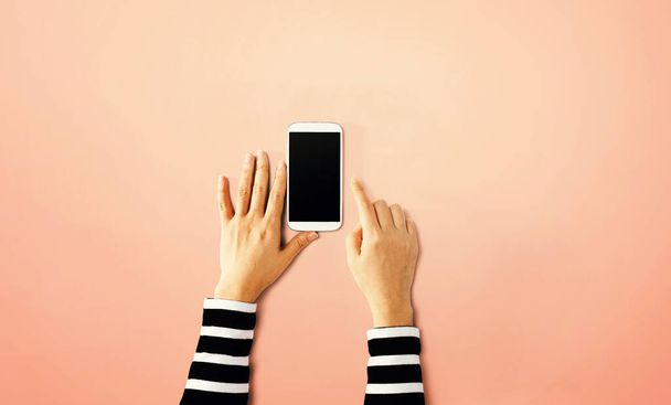 Person using a white smartphone - Valokuva, kuva