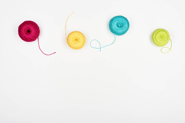 Spools of multi-colored beautiful threads for knitting isolated on white. - Valokuva, kuva