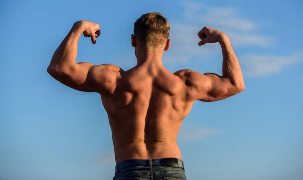 Bodybuilder shape. Sexy body. Triumph and loss. Bigger muscles grow. Increase overall muscle mass. Man muscular chest naked torso sky background. Man muscular athlete bodybuilder show muscles - 写真・画像