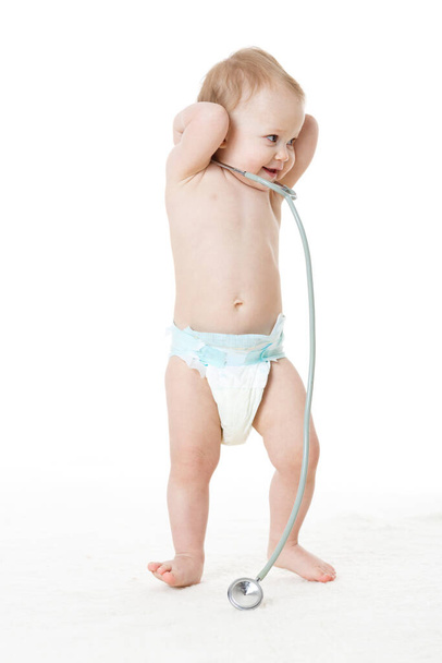 Sweet child with stethoscope on a  white background. - Photo, image