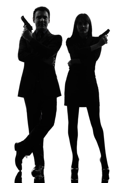 one caucasian man detective secret agent criminal  with gun  in silhouette studio isolated on white background - Foto, Imagem