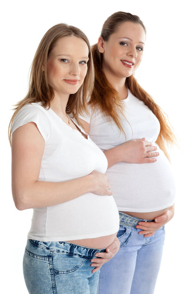 Two pregnant women on a white background. - 写真・画像