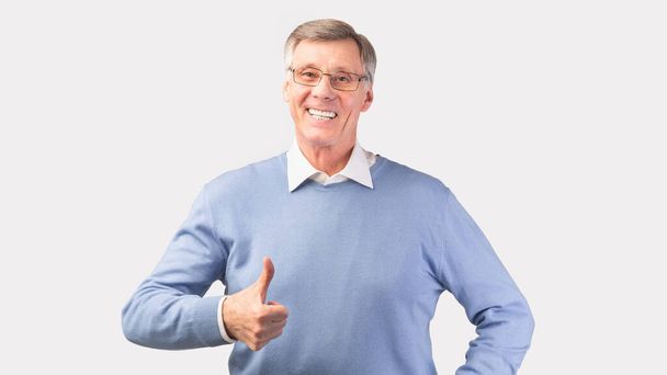 Happy Senior Man Gesturing Thumbs Up Standing, White Background, Panorama - Фото, зображення