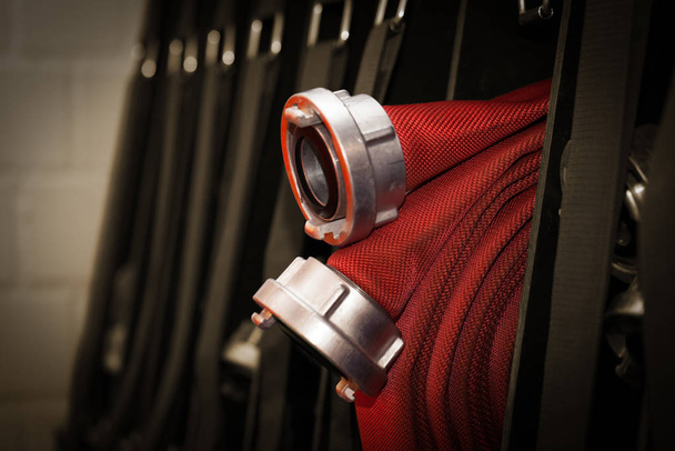 firefighters c hose rolled up in the fire station - 写真・画像