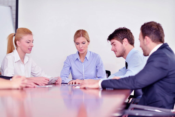 Group of happy young  business people in a meeting at office - 写真・画像