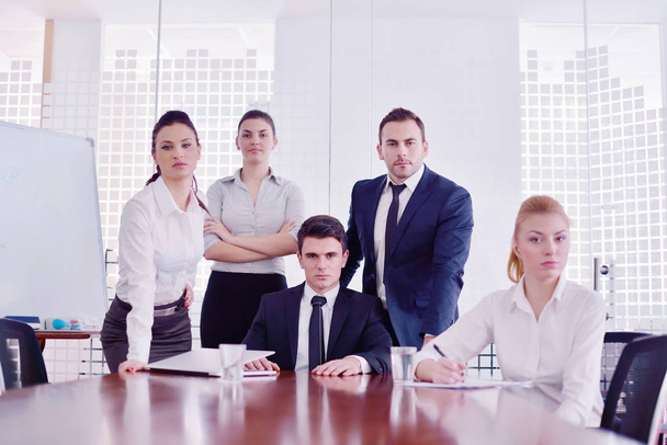Group of happy young  business people in a meeting at office - Фото, изображение