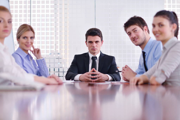 Group of happy young  business people in a meeting at office - 写真・画像