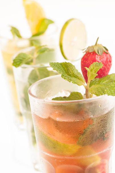 Mojito a Cuban cocktail made with cuban rum, lime, sugar , a splash of soda and flavoured with fresh fruit of your choice - Zdjęcie, obraz