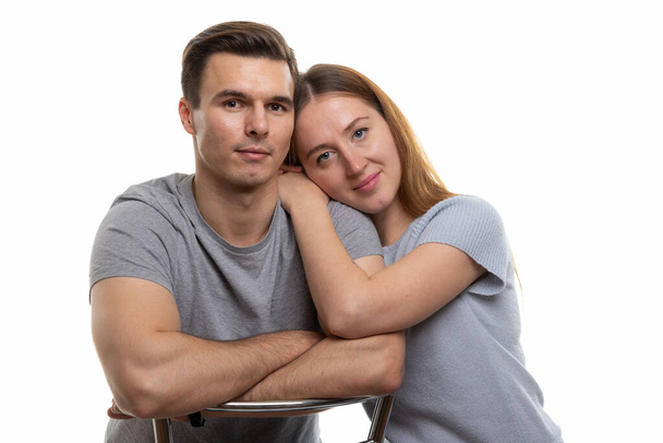 Portrait of a young couple of Europeans, white background - Фото, изображение