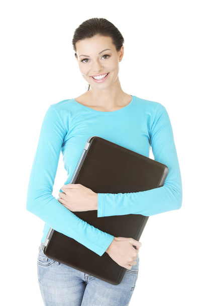 Young woman holding 17 inch laptop , isolated on white - Foto, immagini