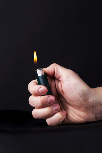 Lighter in hand - Photo, Image