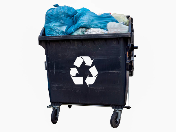full garbage bin with garbage bags isolated white background - Photo, Image