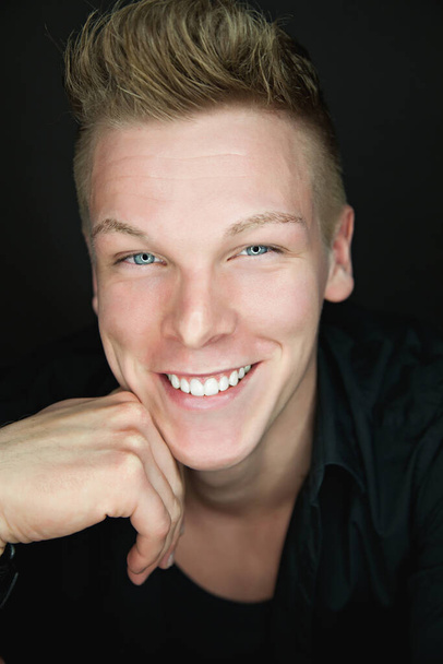 portrait of a beautiful friendly young blond man - Photo, image