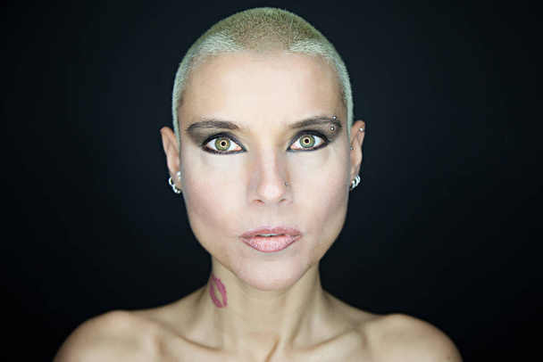 beautiful woman with short hair and tattoos - Фото, изображение