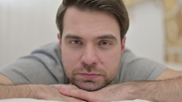 Close up of Beard Young Man looking at Camera in Bed - Кадри, відео