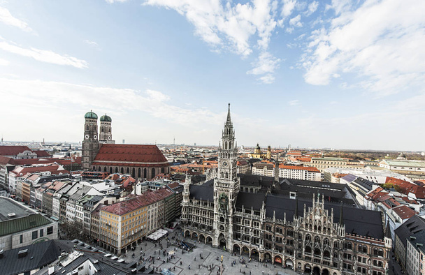 Grand view of Marienplatz City Hall and Cathedral Towers over the blue sky - Фото, зображення