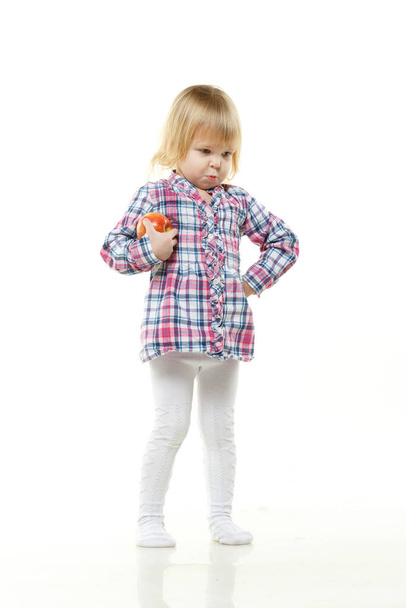 Sweet small girl with fresh apple on a white background. Healthy food. - Zdjęcie, obraz