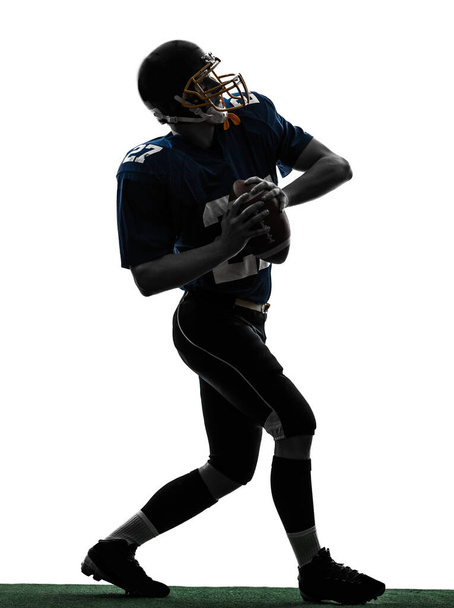 one caucasian quarterback american throwing football player man in silhouette studio isolated on white background - Foto, immagini
