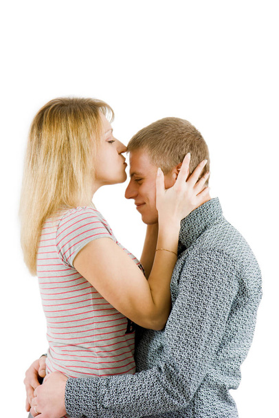 girl kissing a man in a forehead on an isolated white background  - Photo, Image