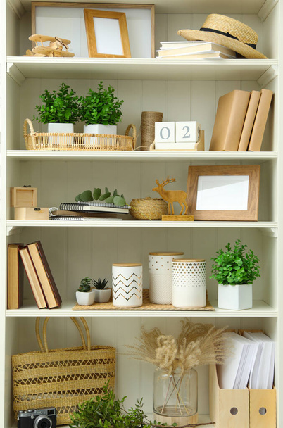 White shelving unit with different decorative elements - Foto, afbeelding
