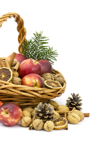 basket full of apples, nuts, cinnamon - Photo, image