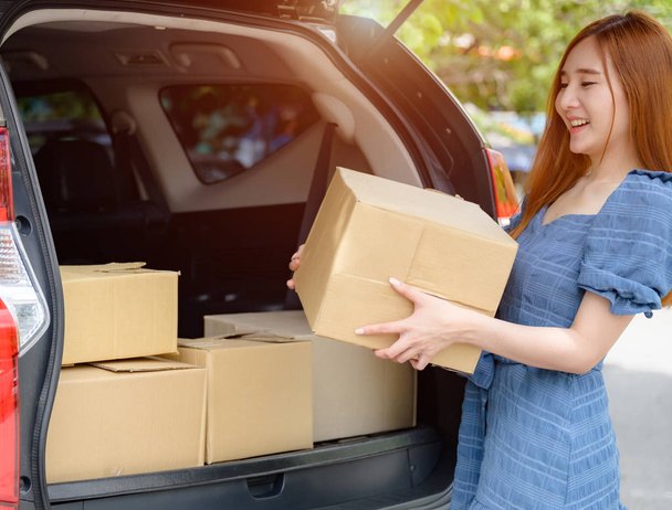 woman holding box packages delivery parcel to the customer, transport and quick delivery goods online by logistic services - 写真・画像