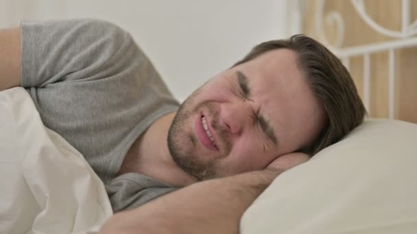 Portrait of Beard Young Man having Headache in Bed - 映像、動画