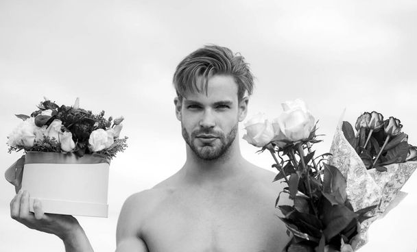 Valentines day. Spring holidays and womans day. Flowers for woman from sexy model man. Flower box. Beauty day concept. - Foto, imagen