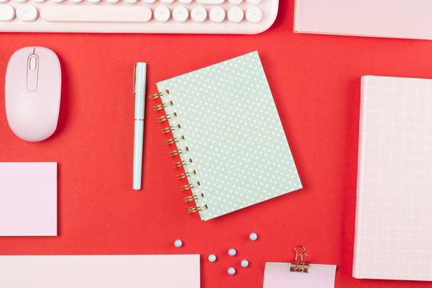 flat lay stationery on work desk in red pastel background - Photo, Image