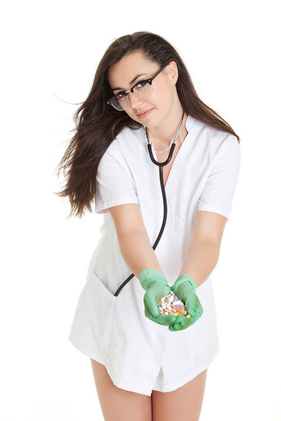 woman doctor with pills in hand. Female doctor holding many pills in her hands - Φωτογραφία, εικόνα
