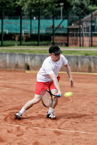 tennis player plays deep forehand volley - Fotoğraf, Görsel