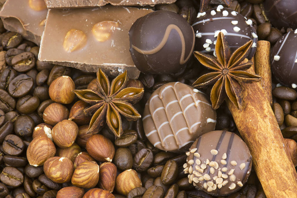 background with chocolate, coffee, spices and nuts - Photo, image