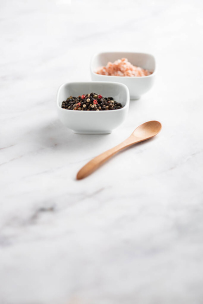 Salt and Pepper on a table  - Фото, изображение