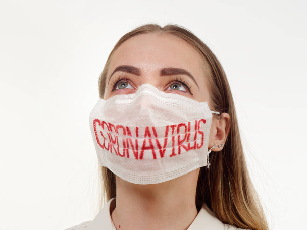 antiviral face mask on a gray background. coronavirus epidemic. - Photo, Image