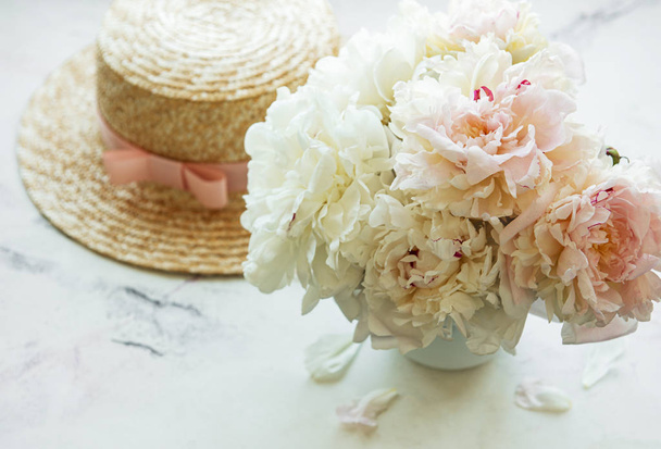 Straw hat and peonies - Photo, Image