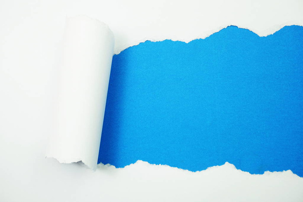 Paper torn with space copy on blue background - Fotoğraf, Görsel