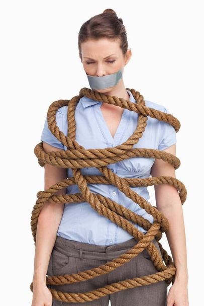 Businesswoman tied up on white background - Photo, Image