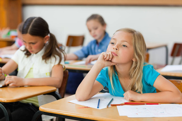 Girl in class doesn't seem very focused - Photo, Image