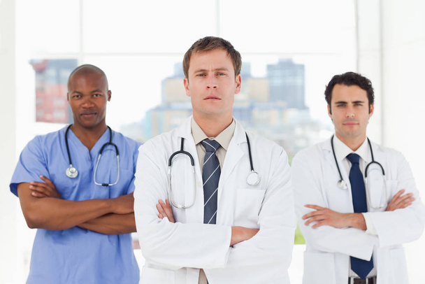Doctors with folded arms standing in front of a window - Photo, Image