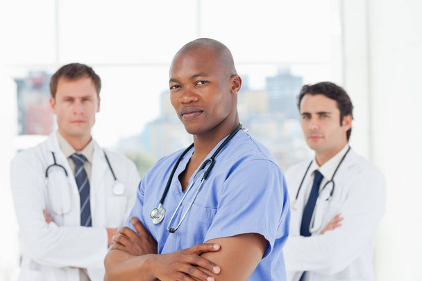 Doctors with their arms crossed standing in front of a window - Photo, Image