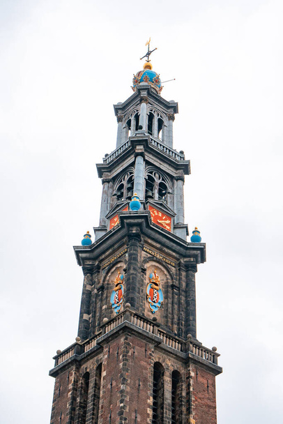 The bell tower of the Western Church, in Dutch Westerkerk in Amsterdam - Fotó, kép
