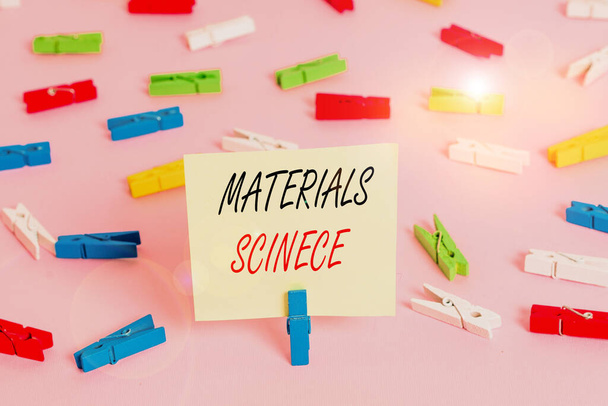 Writing note showing Materials Science. Business concept for interdisciplinary field involving the properties of matter Colored clothespin papers empty reminder pink floor office pin - Photo, Image