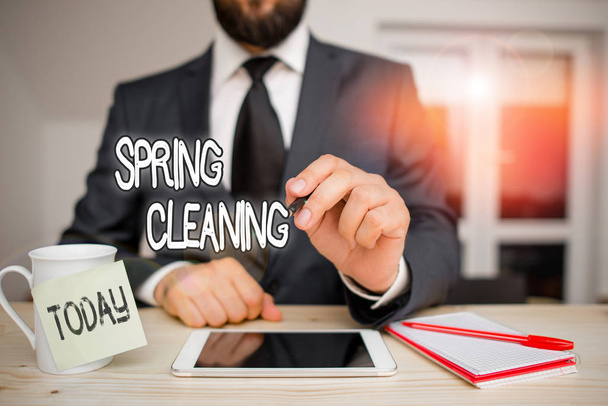 Word writing text Spring Cleaning. Business photo showcasing thorough cleaning of a house or room during spring Male human wear formal clothes present presentation use hi tech smartphone - Photo, Image