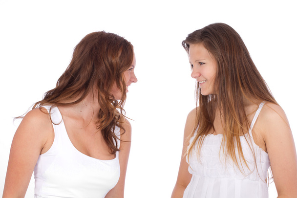 Two teenage girls on white background - Photo, image