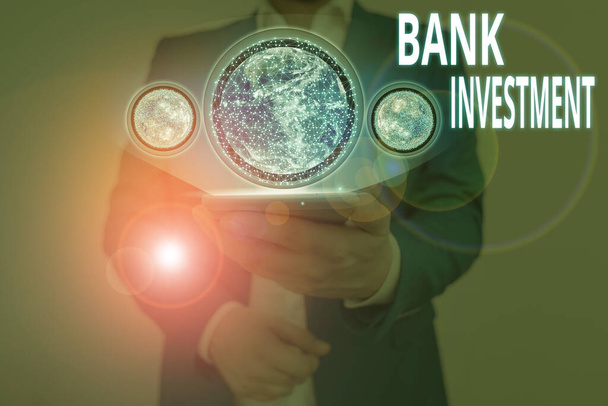 Writing note showing Bank Investment. Business concept for financial intermediary that performs a variety of services Elements of this image furnished by NASA - Photo, Image