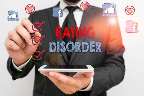 食べる障害を示す概念的な手書き。不規則な食生活を特徴とする病気の概念 - 写真・画像