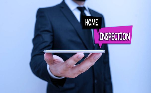 Writing note showing Home Inspection. Business photo showcasing noninvasive examination of the condition of a home Male human wear formal work suit hold smartphone using hand. - Photo, Image